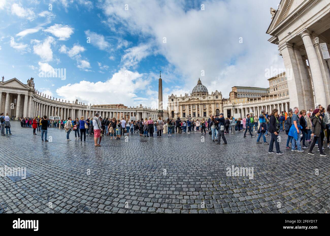 Vatican - Oct 06, 2018: Tourists bustle around St. Peter's Square in front of St. Peter’s Cathedral Stock Photo