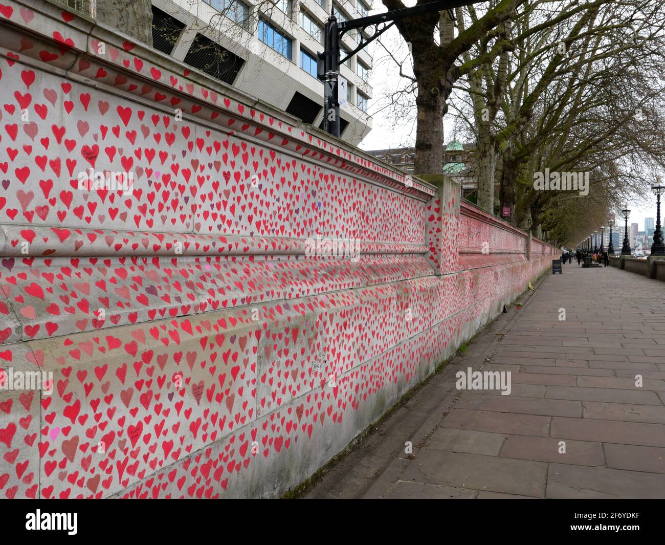 150000 hearts painted in London to represent lives lost to Covid 19 across the UK .Each heart represents someone who was loved and was lost too soon to Covid - 19 . Matt Fowler , co Founder said when they started painting the hearts .Labour leader Keir Starmer arrived and showed support . Hopefully the council will seal the hearts once they are finished so it can become a permanent memorial for those who lost there lives and hopefully  a public enquiry can take place to investigate the failings of the Tory Government in order to learn lessons quickly  and prevent further loss of life ... Stock Photo