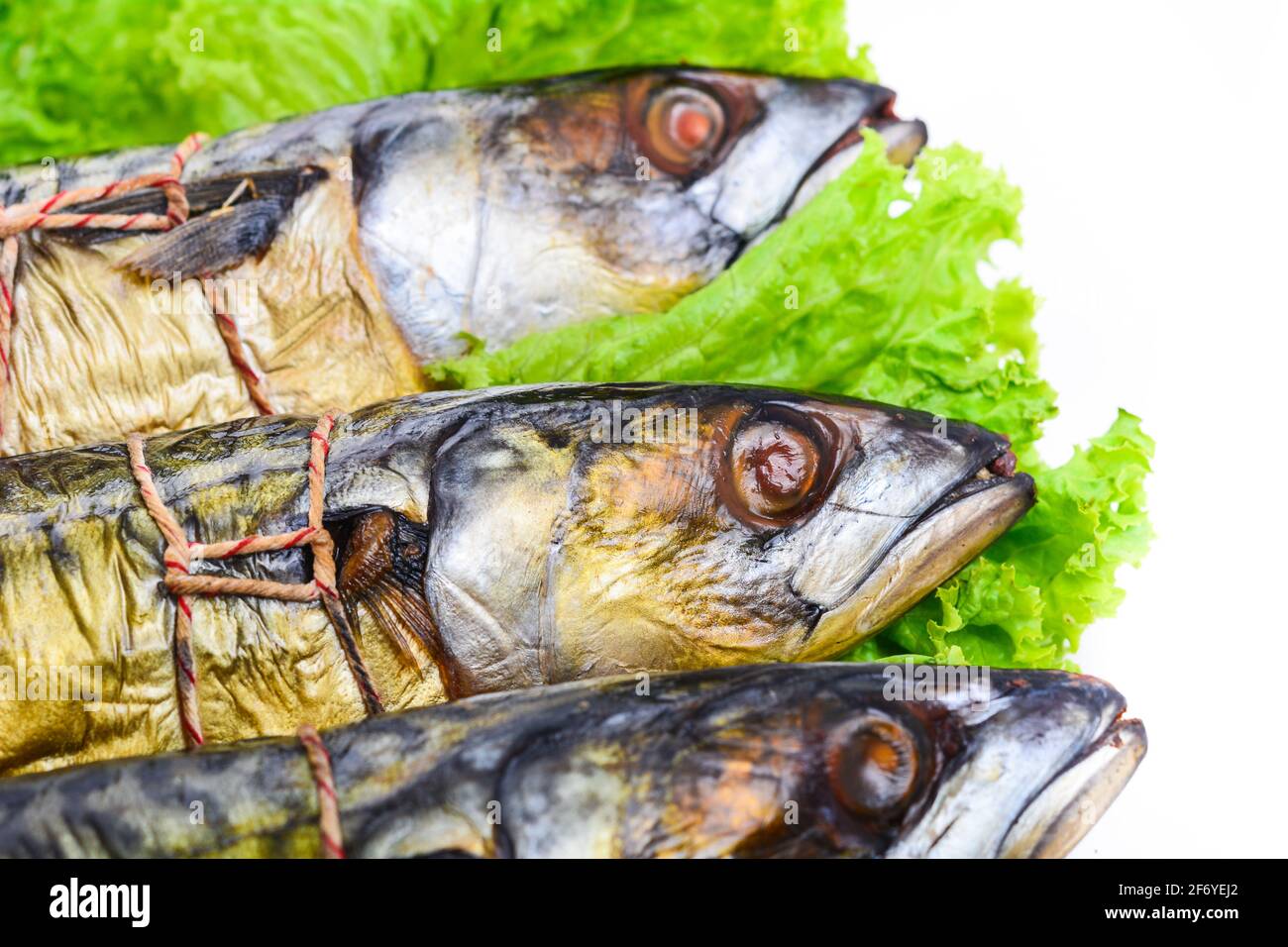 Appetizing smoked fish on a platter Stock Photo