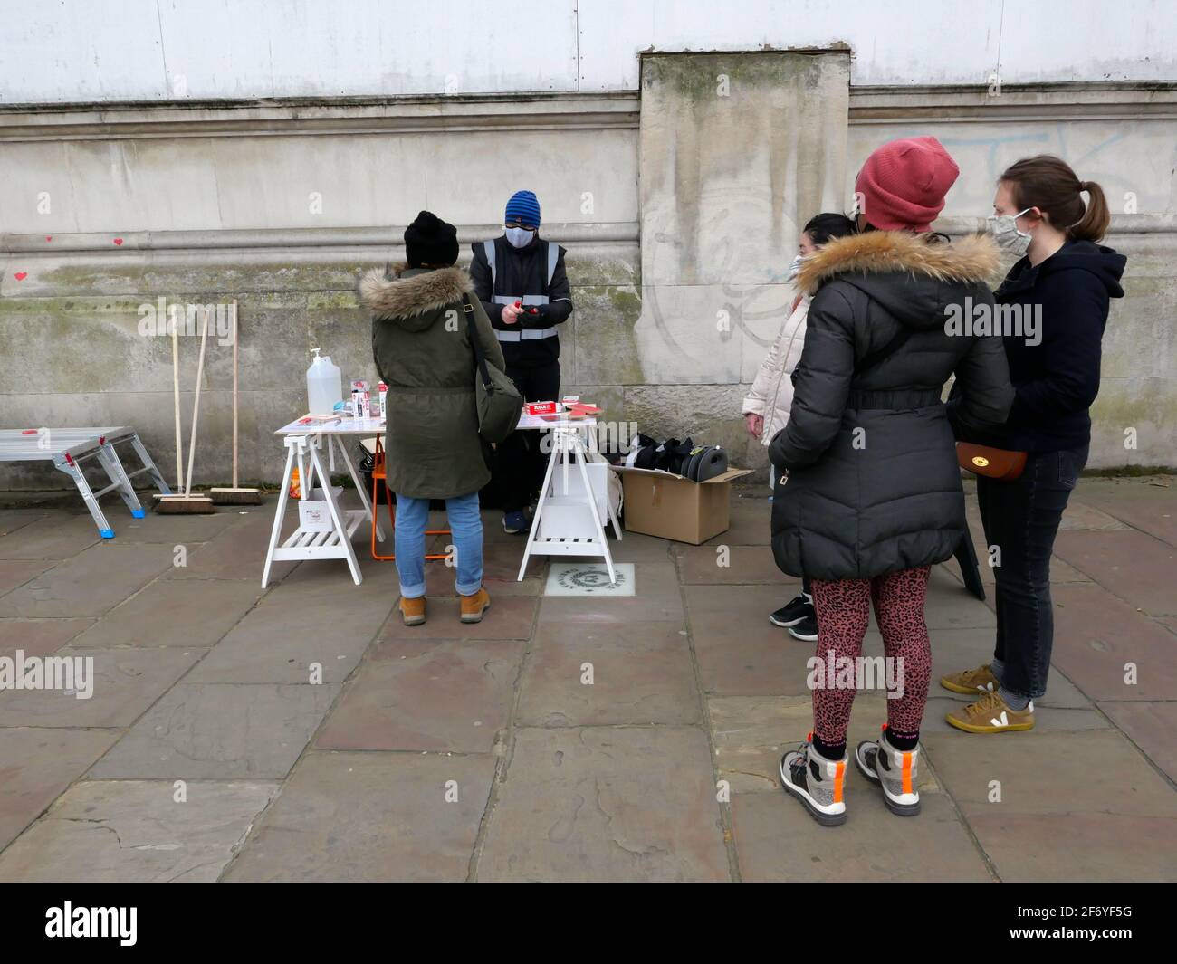 150000 hearts painted in London to represent lives lost to Covid 19 across the UK .Each heart represents someone who was loved and was lost too soon to Covid - 19 . Matt Fowler , co Founder said when they started painting the hearts .Labour leader Keir Starmer arrived and showed support . Hopefully the council will seal the hearts once they are finished so it can become a permanent memorial for those who lost there lives and hopefully  a public enquiry can take place to investigate the failings of the Tory Government in order to learn lessons quickly  and prevent further loss of life ... Stock Photo