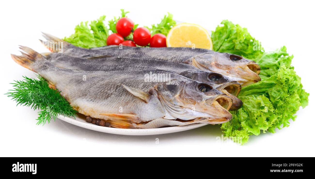 Group of dried fish at plate . Seafood Stock Photo