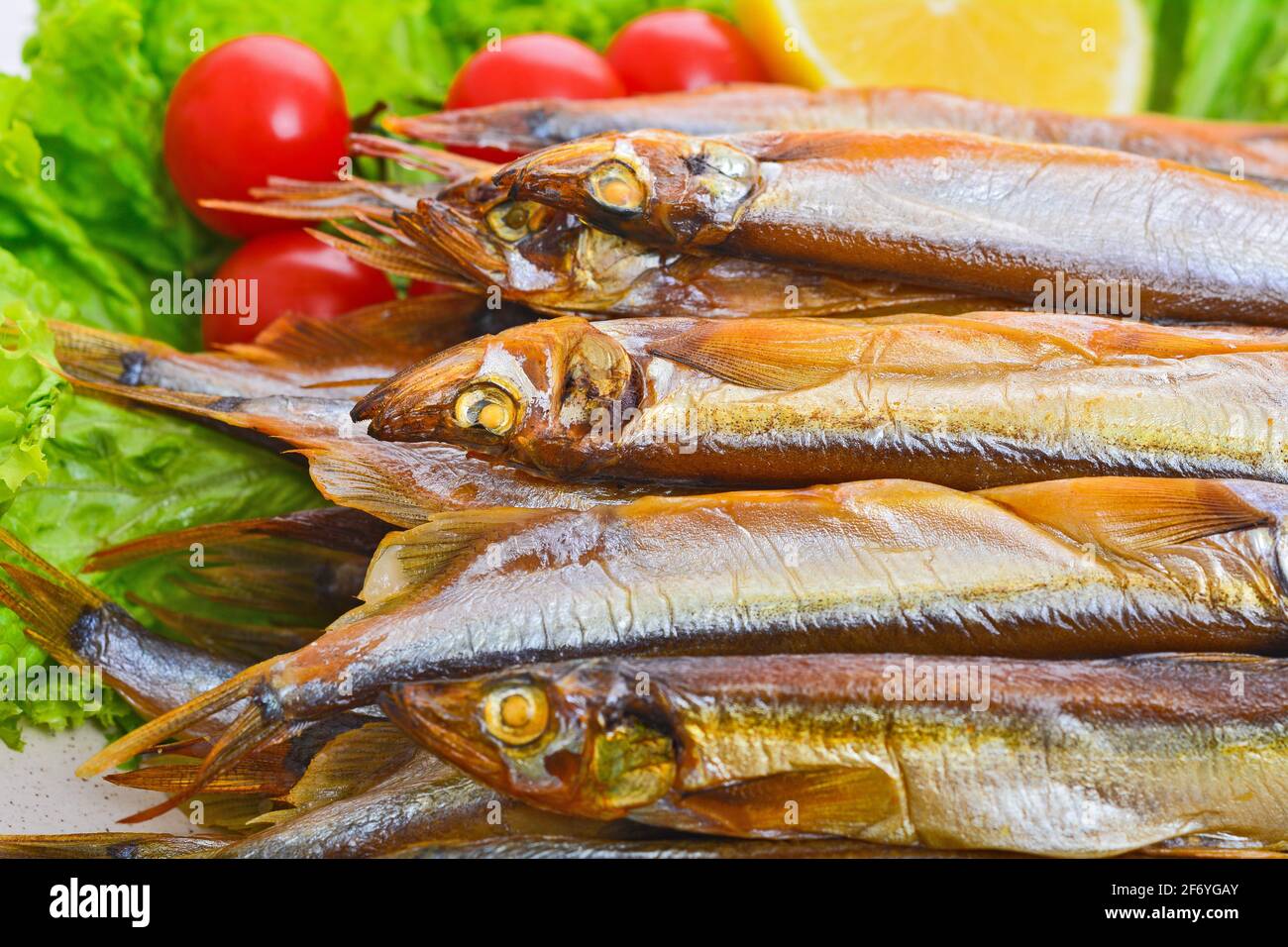 Dried smoked capelin on a plate Stock Photo