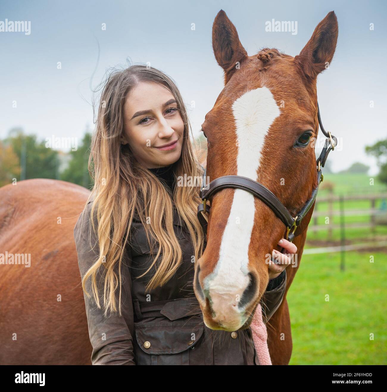 Girl posing with her Chestnut horse Stock Photo