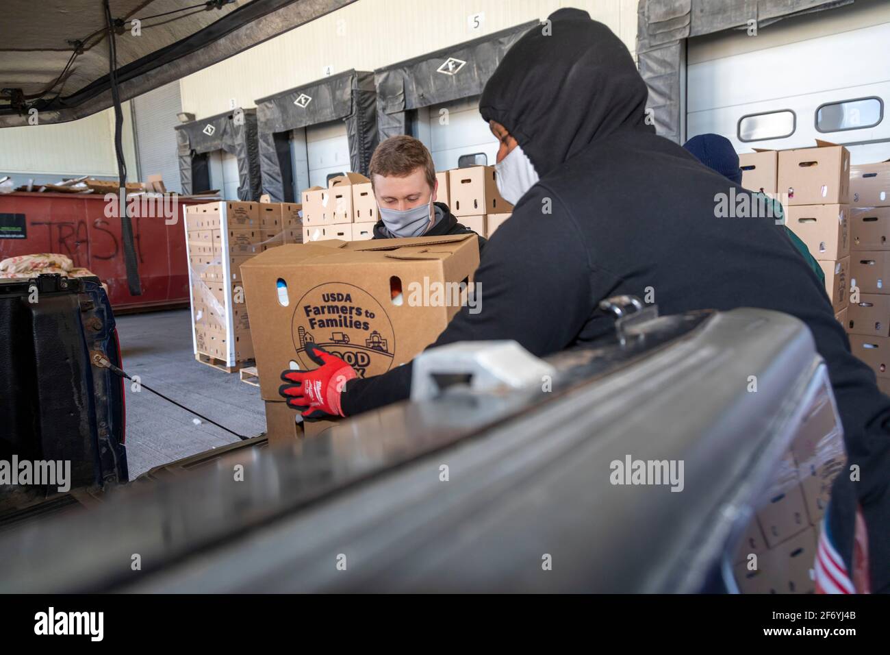 Detroit, Michigan, USA. 2nd Apr, 2021. Volunteers with Food Rescue US-Detroit distribute boxes of food every week to social service agencies. Much of the food comes from the Department of Agriculture's Farmers to Families program. Credit: Jim West/Alamy Live News Stock Photo