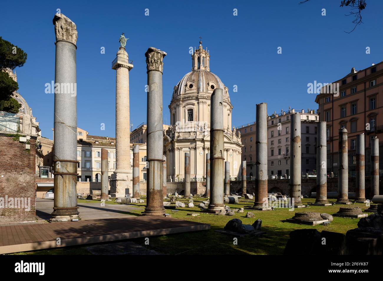 Rome. Italy. Forum of Trajan (Foro di Traiano), the granite columns of the Basilica Ulpia stand in the foreground, the Column of Trajan (AD 113) behin Stock Photo