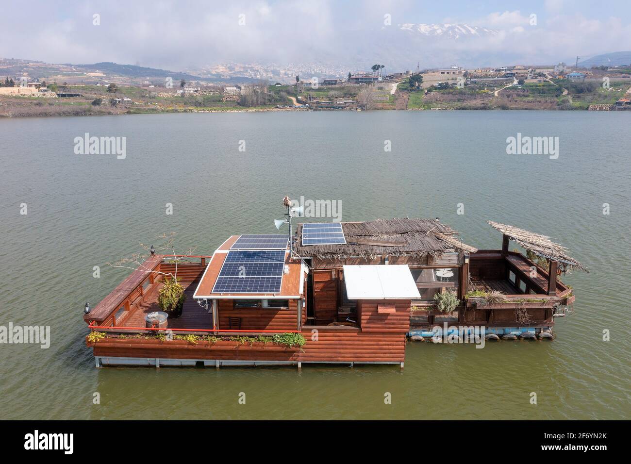 Self Sufficient floating house with solar panels, Aerial view. Stock Photo