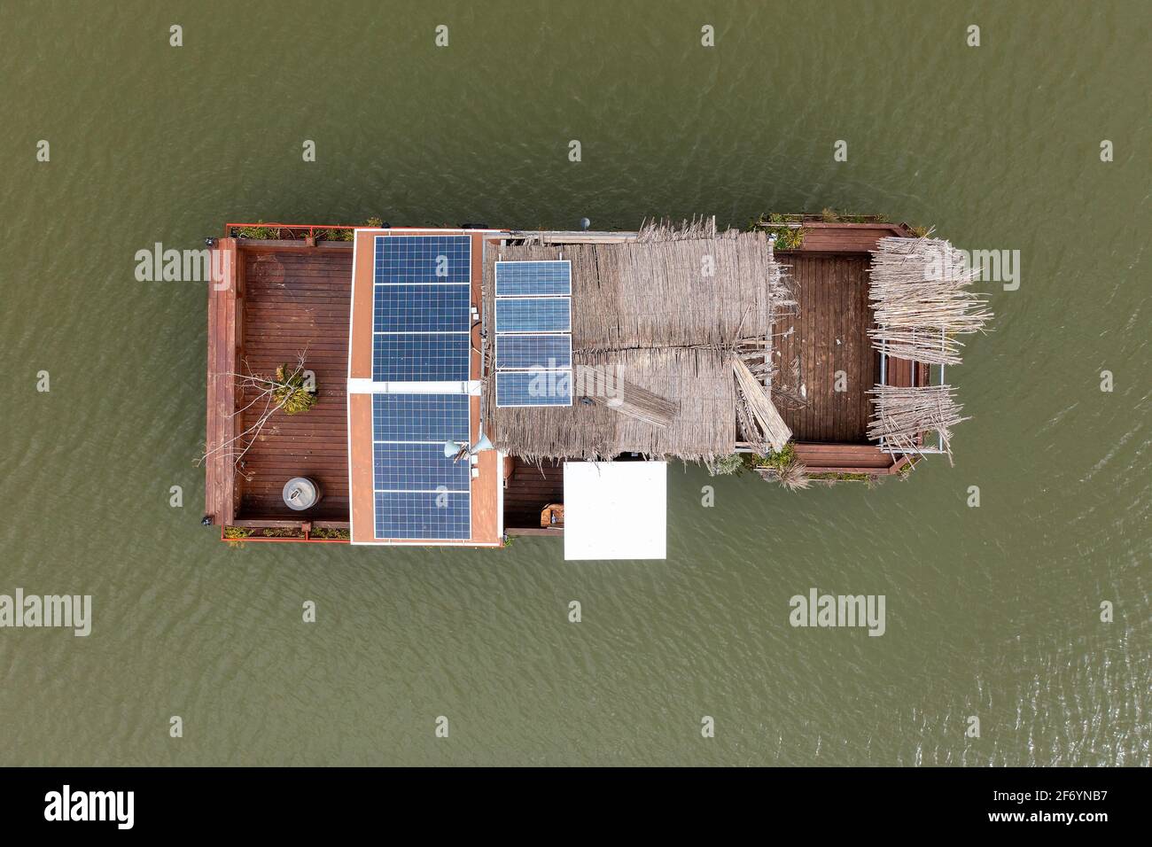 Self Sufficient floating house with solar panels, Aerial view. Stock Photo