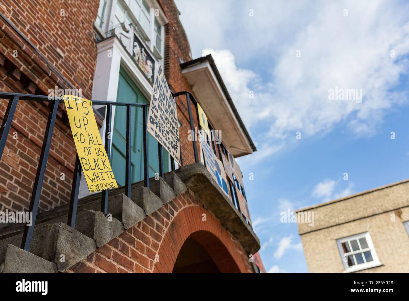 Woodbridge, Suffolk, UK June 19 2020: Homemade BLM protest signs that have been fixed to the town hall in the center of Woodbridge to show the town an Stock Photo