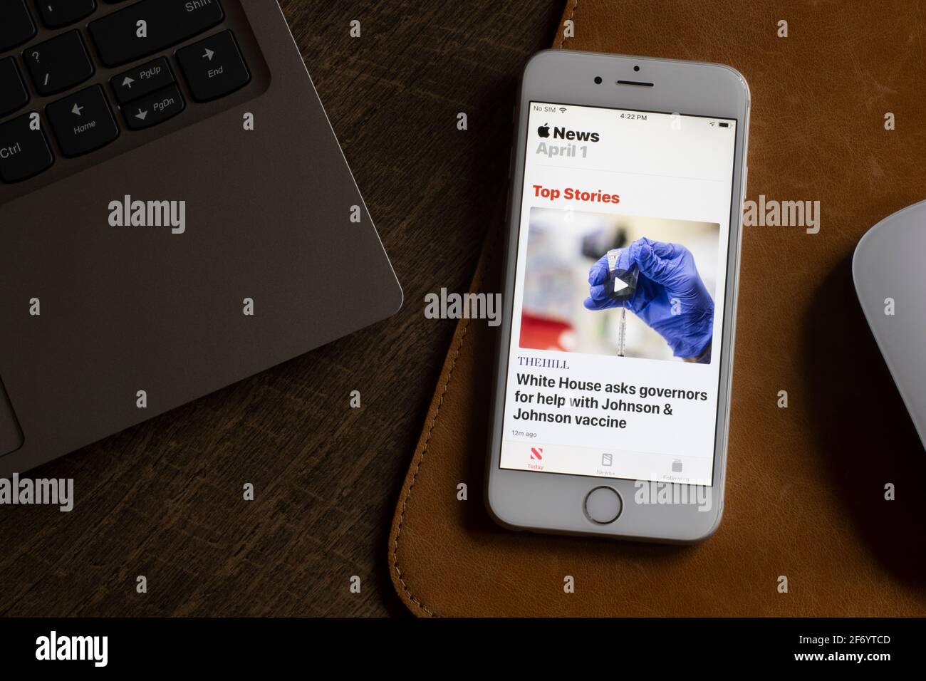 Apple News app is seen launched on an iPhone on April 1, 2021. Apple News aggregates multiple news sources, blogs, breaking stories, video publication... Stock Photo