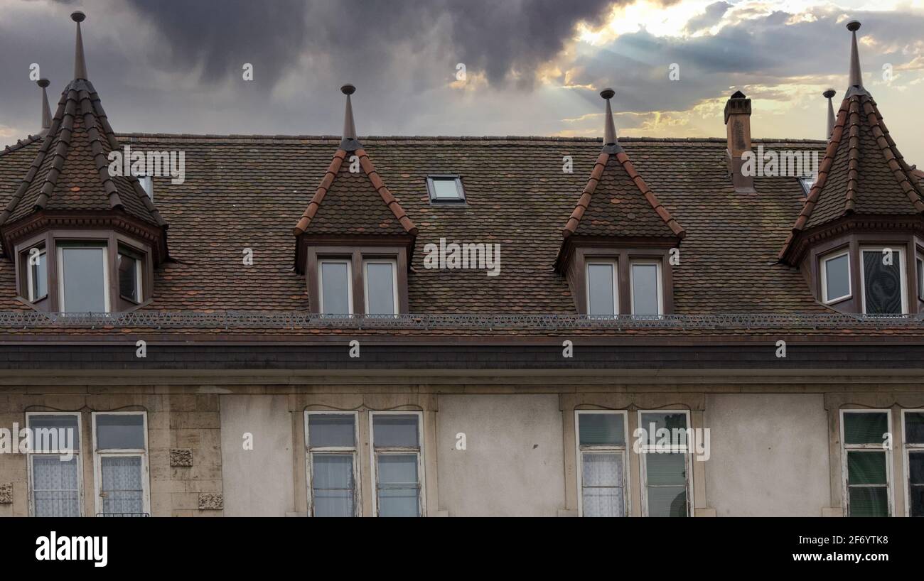 Urban house with stormy skies in the background Stock Photo