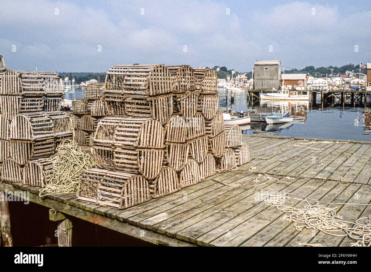 Old wooden lobster traps on the dock in Boothbay Harbor, Maine Stock