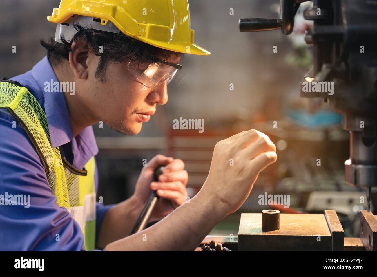 Man Operating Machine Label Place of work technology manual worker standing working operating ...