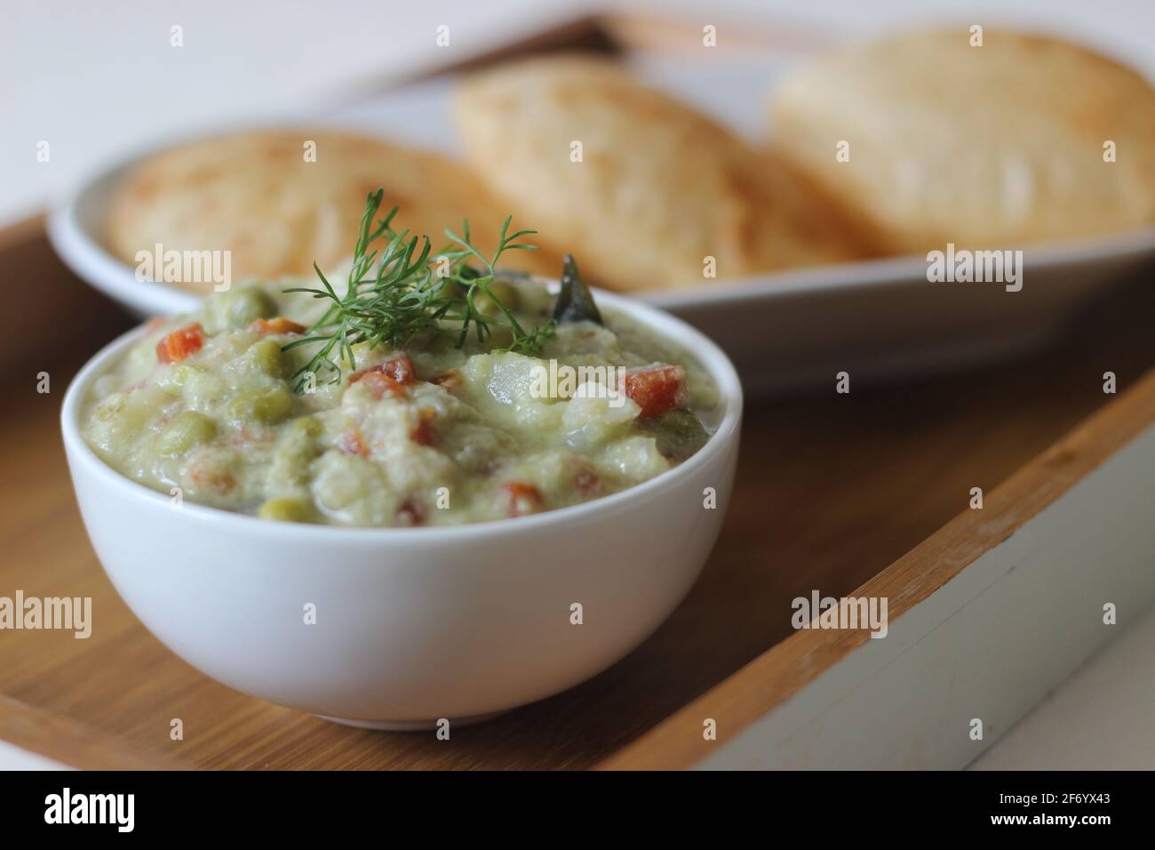 Mixed vegetable curry in a coconut cashew gravy served with deep fried