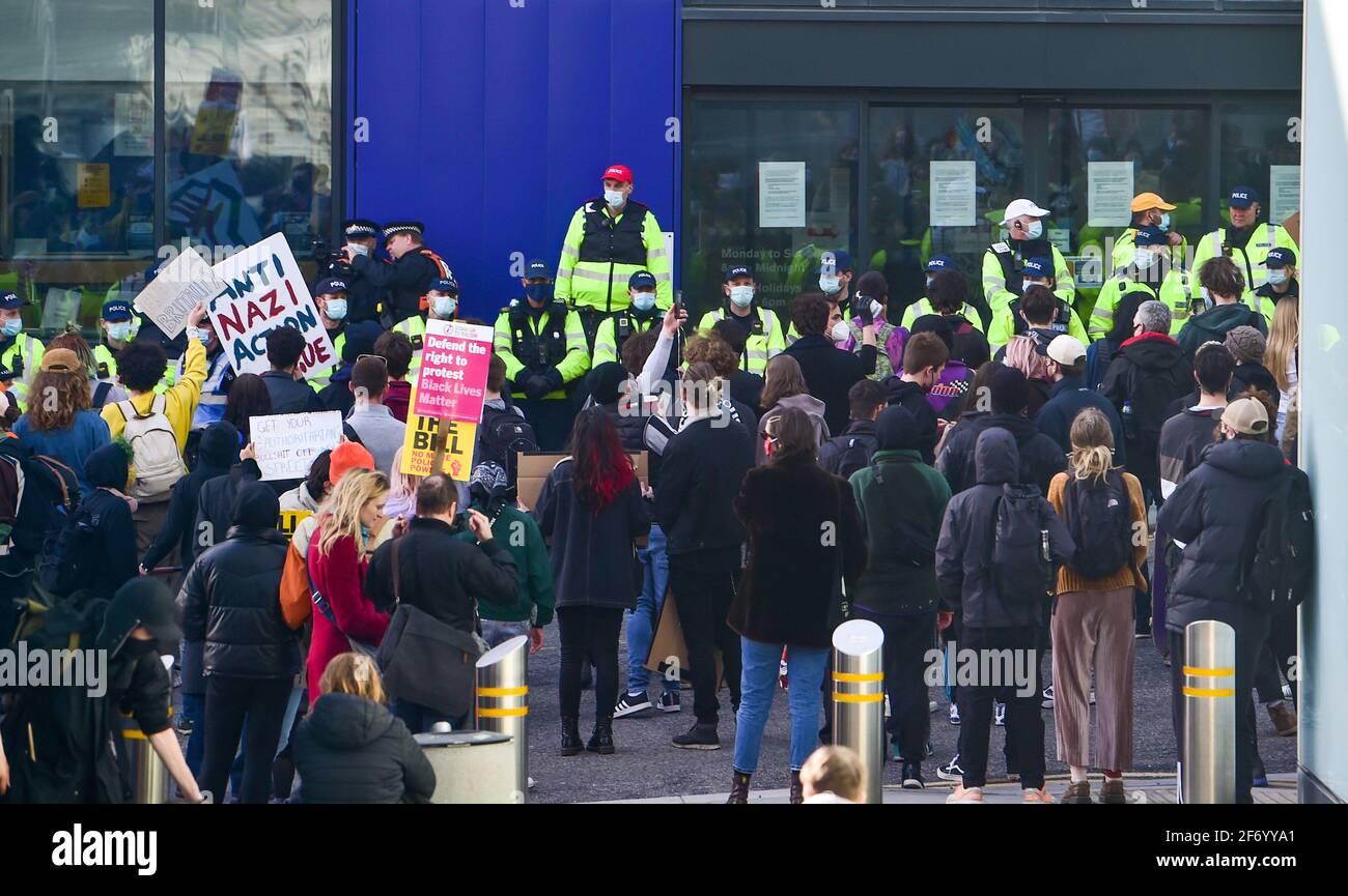 Brighton UK 3rd April 2021 - Police line up outside Brighton Police Station as hundreds of 'Kill The Bill' protesters take part in a protest against the governments controversial new bill which would give police powers to crack down on peaceful protest  :  Credit Simon Dack / Alamy Live News Stock Photo