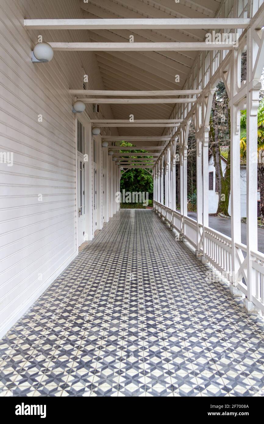 Patio. Classic white painted wooden house Stock Photo - Alamy