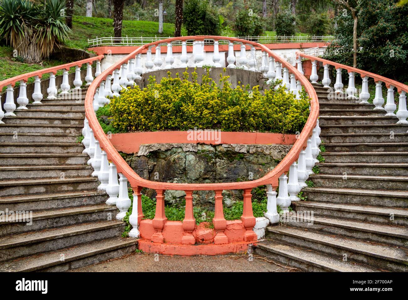 Oval, spiral shape outdoor staircase. Garden architecture Stock Photo