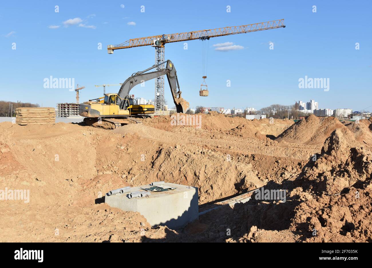 Excavator dig the trenches at a construction site. Trench for laying ...