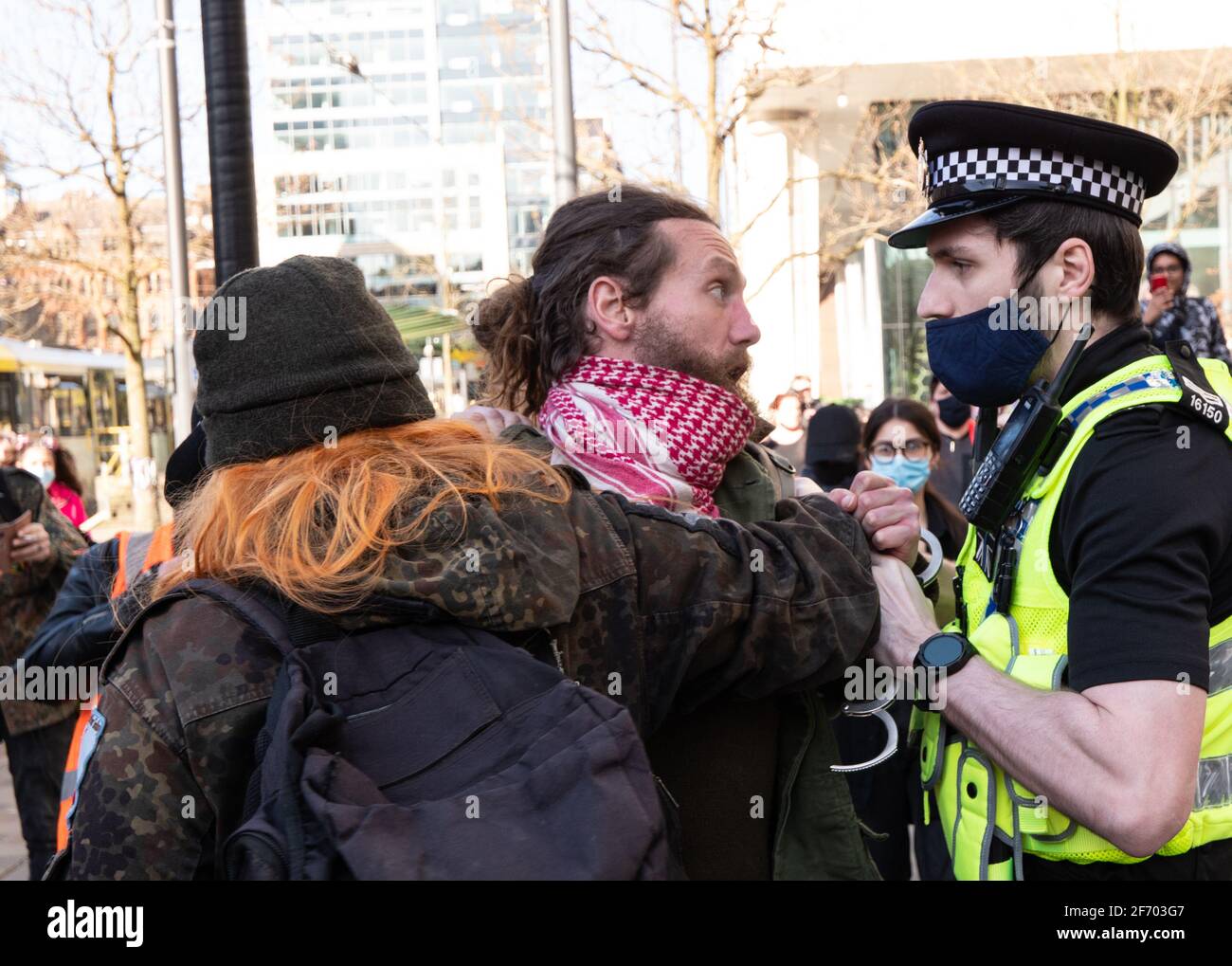 Manchester, UK. 3rd April, 2021. Protestor comes eye to eye with policeman as Kill the Bill protestors protest in Manchester. Credit: Gary Roberts/Alamy Live News Stock Photo