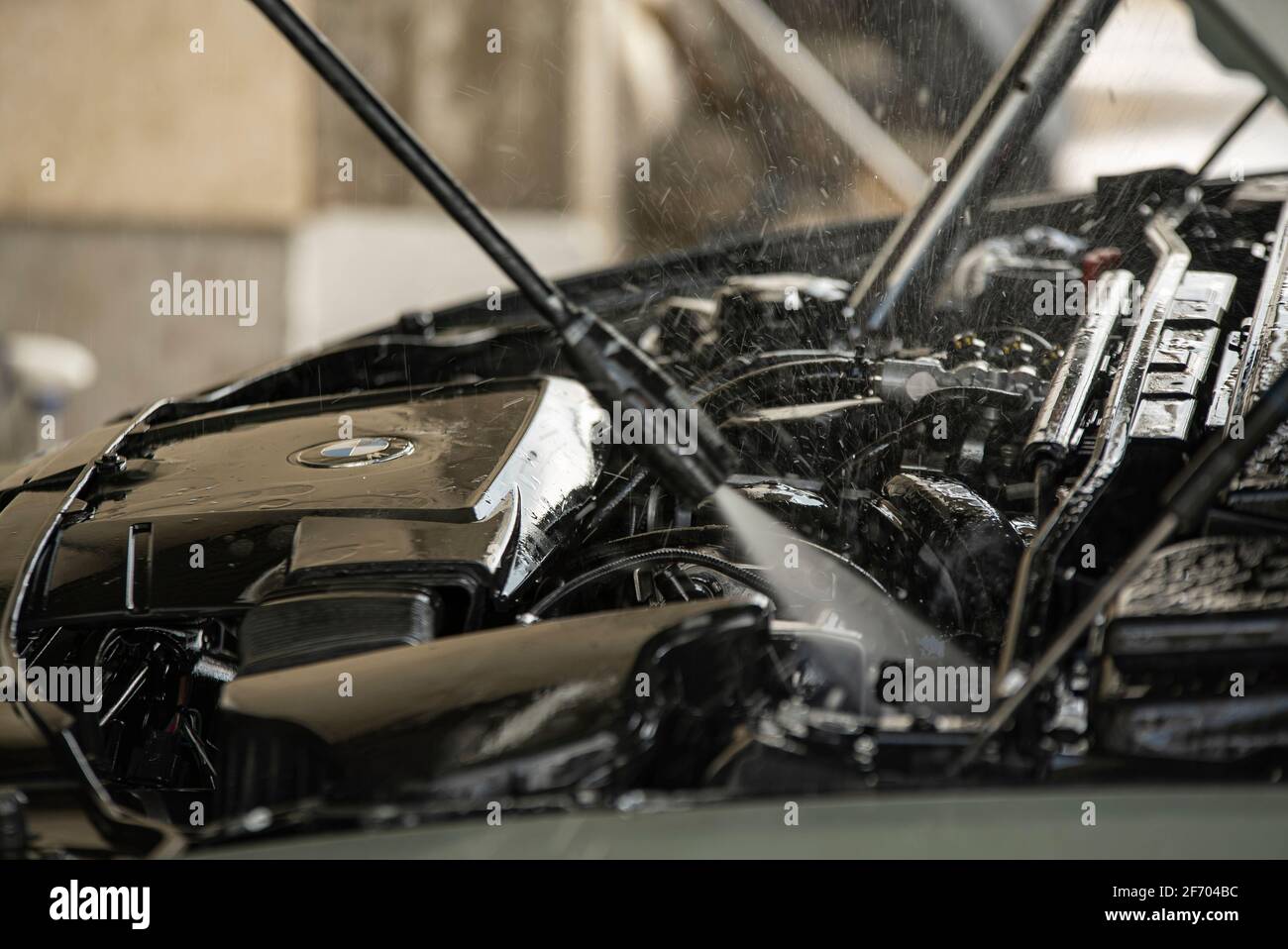 Wash the car engine detail with selective focus Stock Photo - Alamy