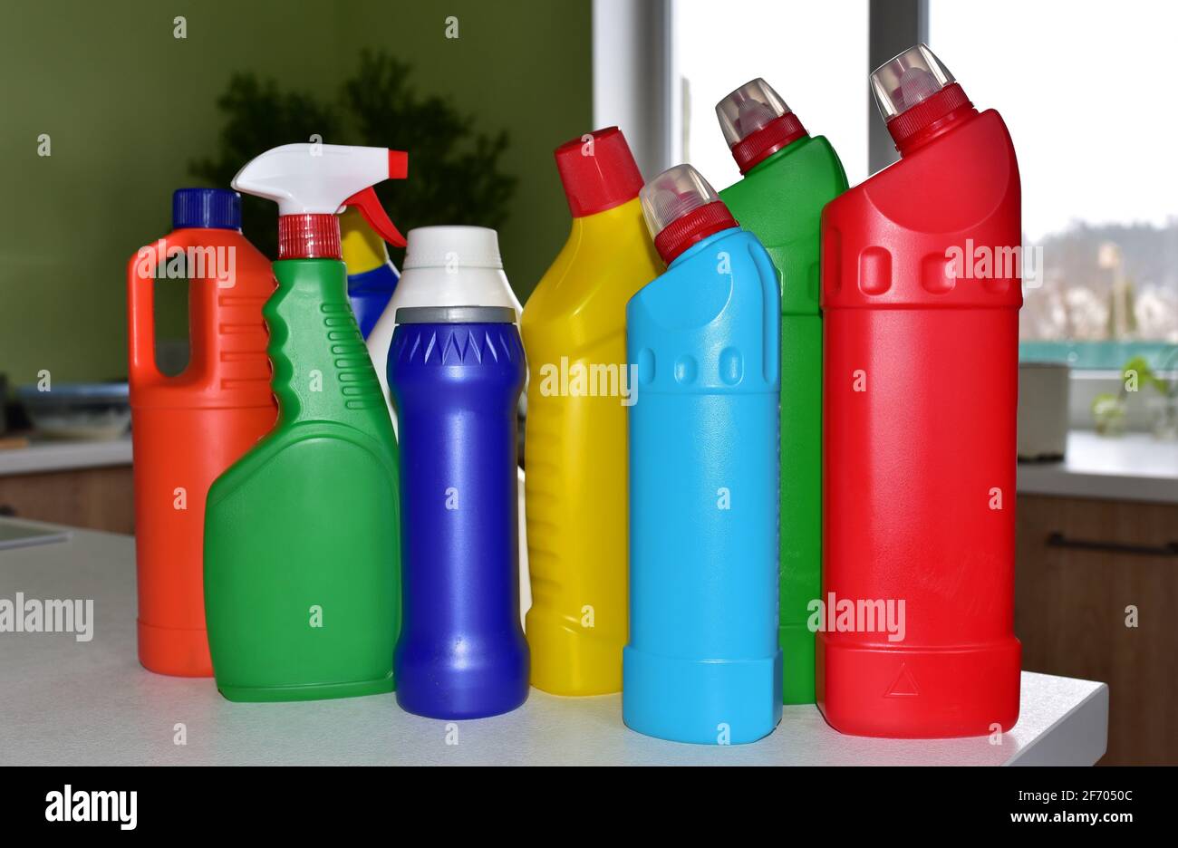 Detergent bottles at kitchen in home. Detergents and laundry concept