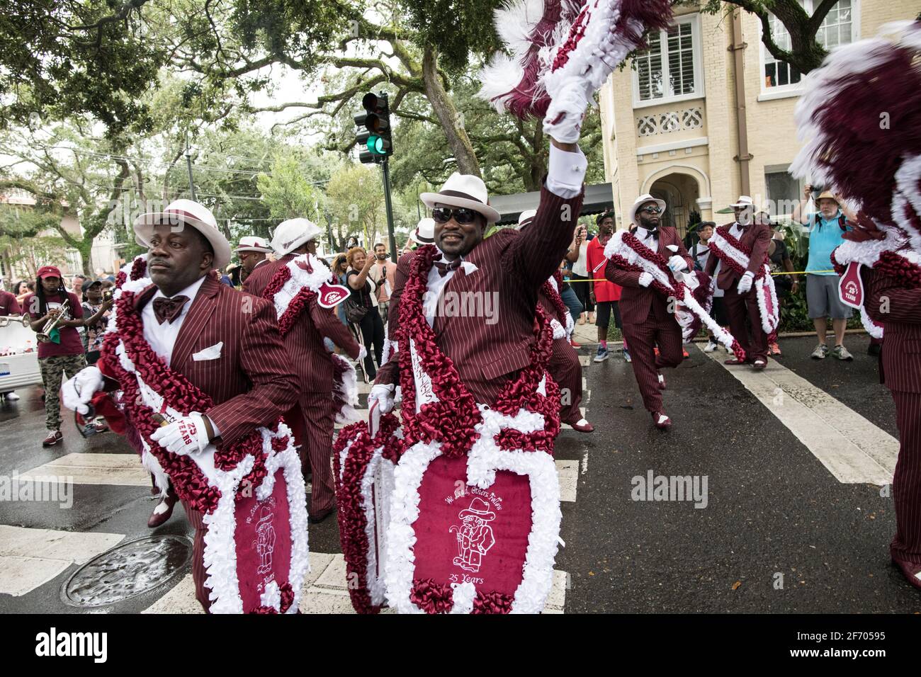 Young Men Olympians, New Orleans Social Aid and Pleasure Club Second Line (Secondline) Parade dancers on Second Line Sunday. New Orleans, Louisiana. Stock Photo