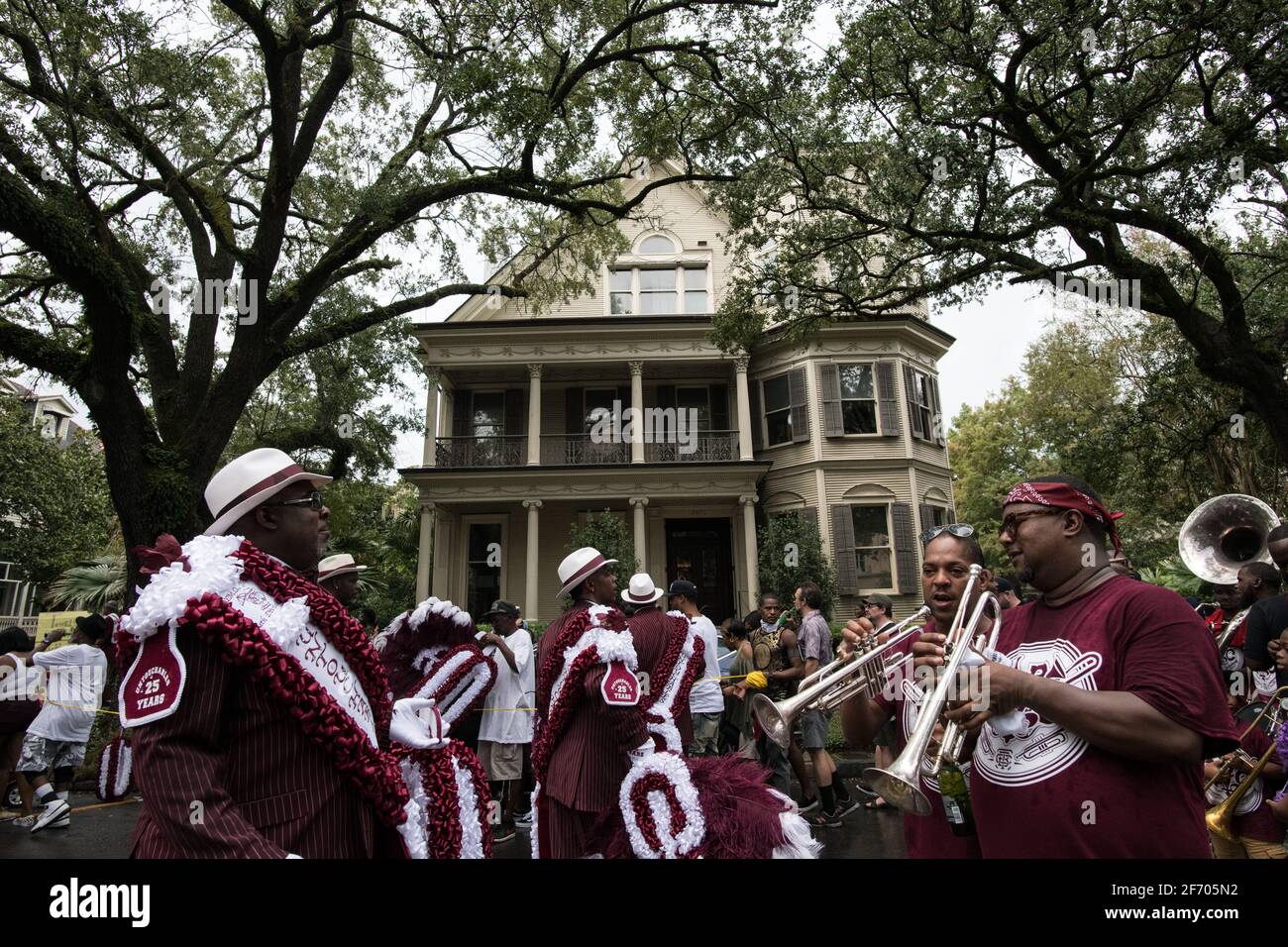 Young Men Olympians, New Orleans Social Aid and Pleasure Club Second Line (Secondline) Parade dancers on Second Line Sunday. New Orleans, Louisiana. Stock Photo