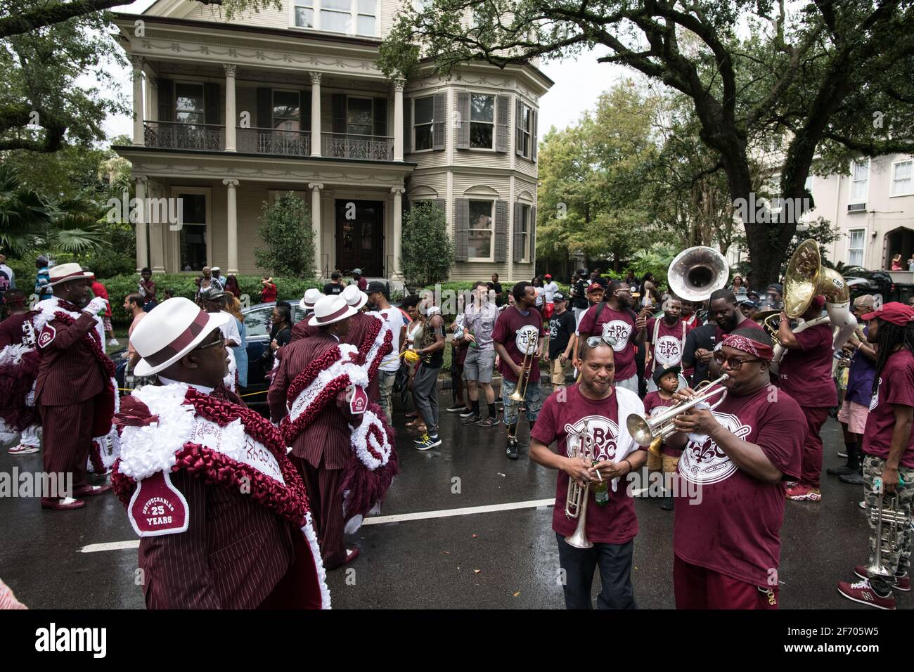 Young Men Olympians, New Orleans Social Aid and Pleasure Club Second Line (Secondline) Parade dancers on Second Line Sunday. New Orleans, Louisiana. Stock Photo