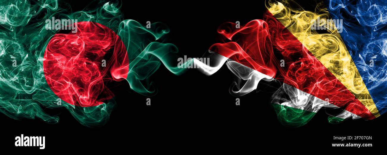 Bangladesh, Bangladeshi vs Seychelles, Seychellois smoky mystic flags placed side by side. Thick colored silky abstract smokes flags. Stock Photo