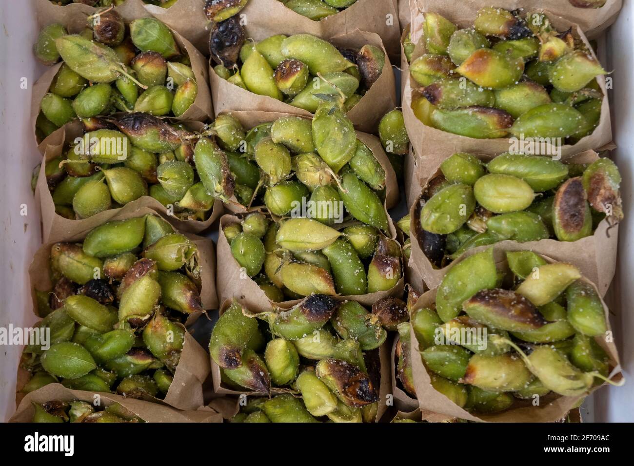 Salted Vicia faba, also known in the culinary sense as the broad bean, fava bean, or faba bean for sale in the old city of Jerusalem Israel Stock Photo