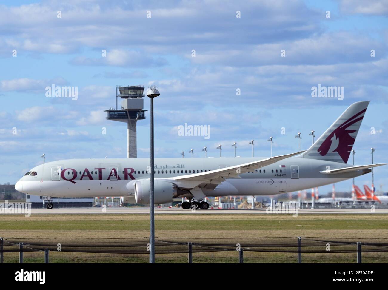 03 April 2021, Brandenburg, Schönefeld: A Boeing 787 Dreamliner of the airline Qatar Airways takes off from the southern runway of Berlin Brandenburg Airport 'Willy Brandt' in the direction of Doha. Since the beginning of April 2021, both runways have been used in monthly rotation in order to distribute aircraft noise pollution more evenly in the region. Photo: Soeren Stache/dpa-Zentralbild/ZB Stock Photo