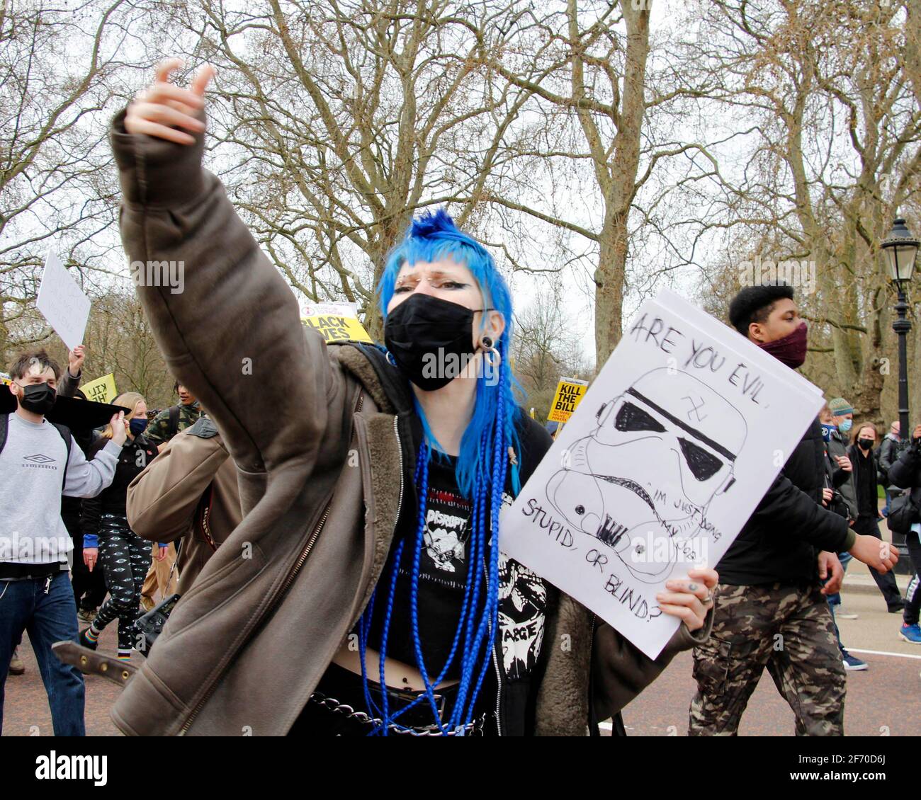 London, UK. 03rd Apr, 2021. A woman gestures and joins in a chant aimed towards the Buckingham Palace, demanding the new policing bill be dropped. London. Anna Hatfield/ Pathos Images Credit: One Up Top Editorial Images/Alamy Live News Stock Photo