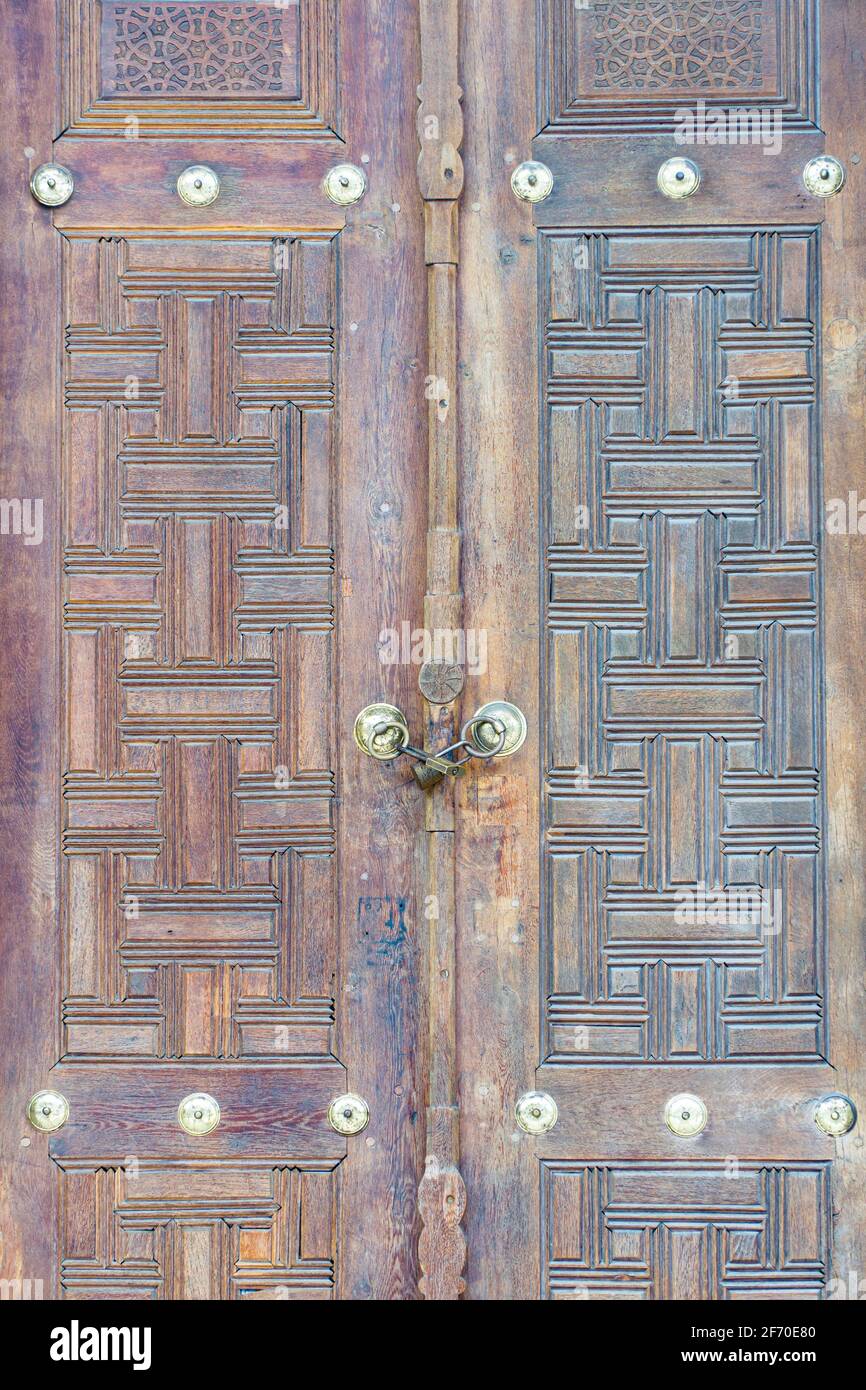 Old wooden door with beautiful patterns Stock Photo