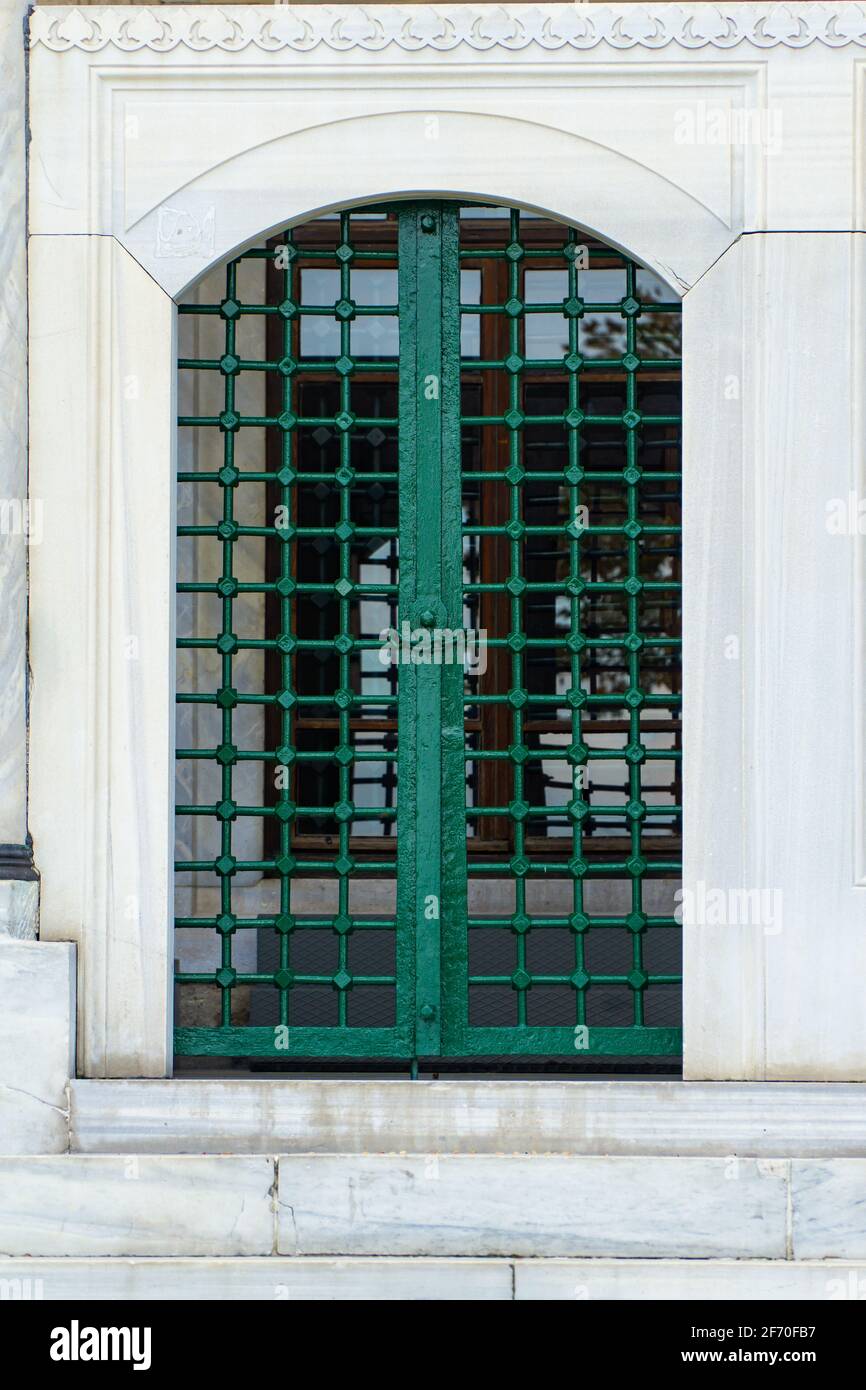 Metal window on a stone wall Stock Photo Alamy