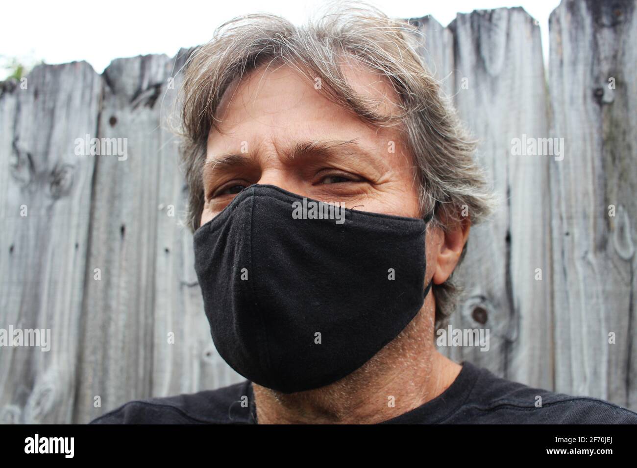 Old man with mask hi-res stock photography and images - Alamy