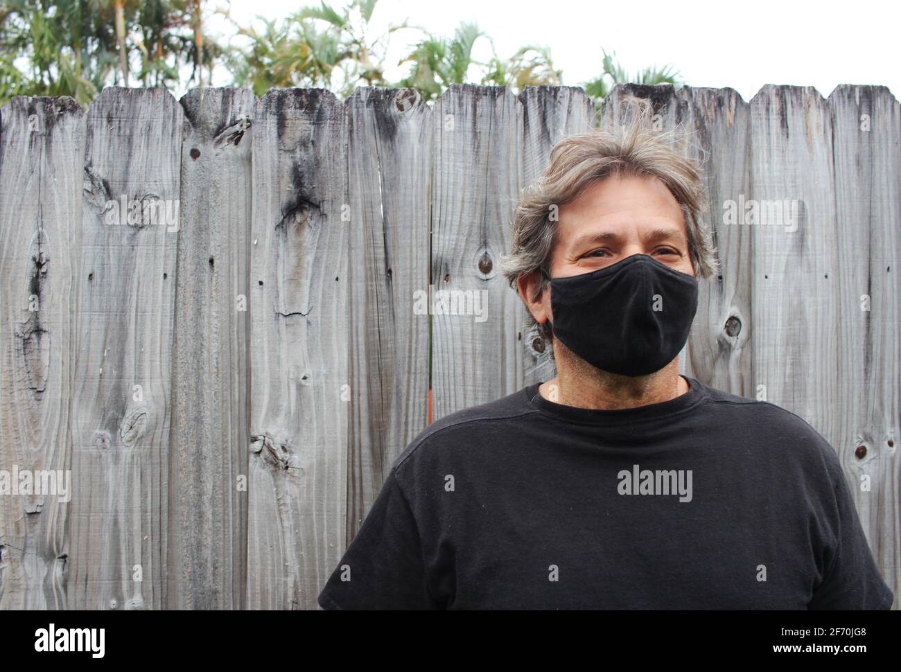 Old man with mask hi-res stock photography and images - Alamy