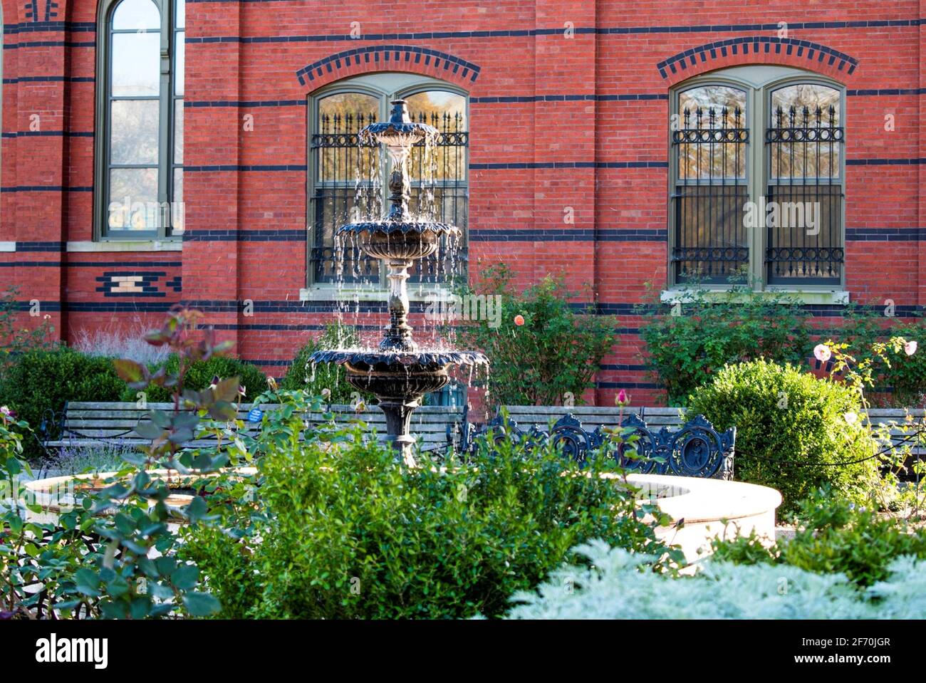 fountain in the middle of this beautiful colonial garden Stock Photo