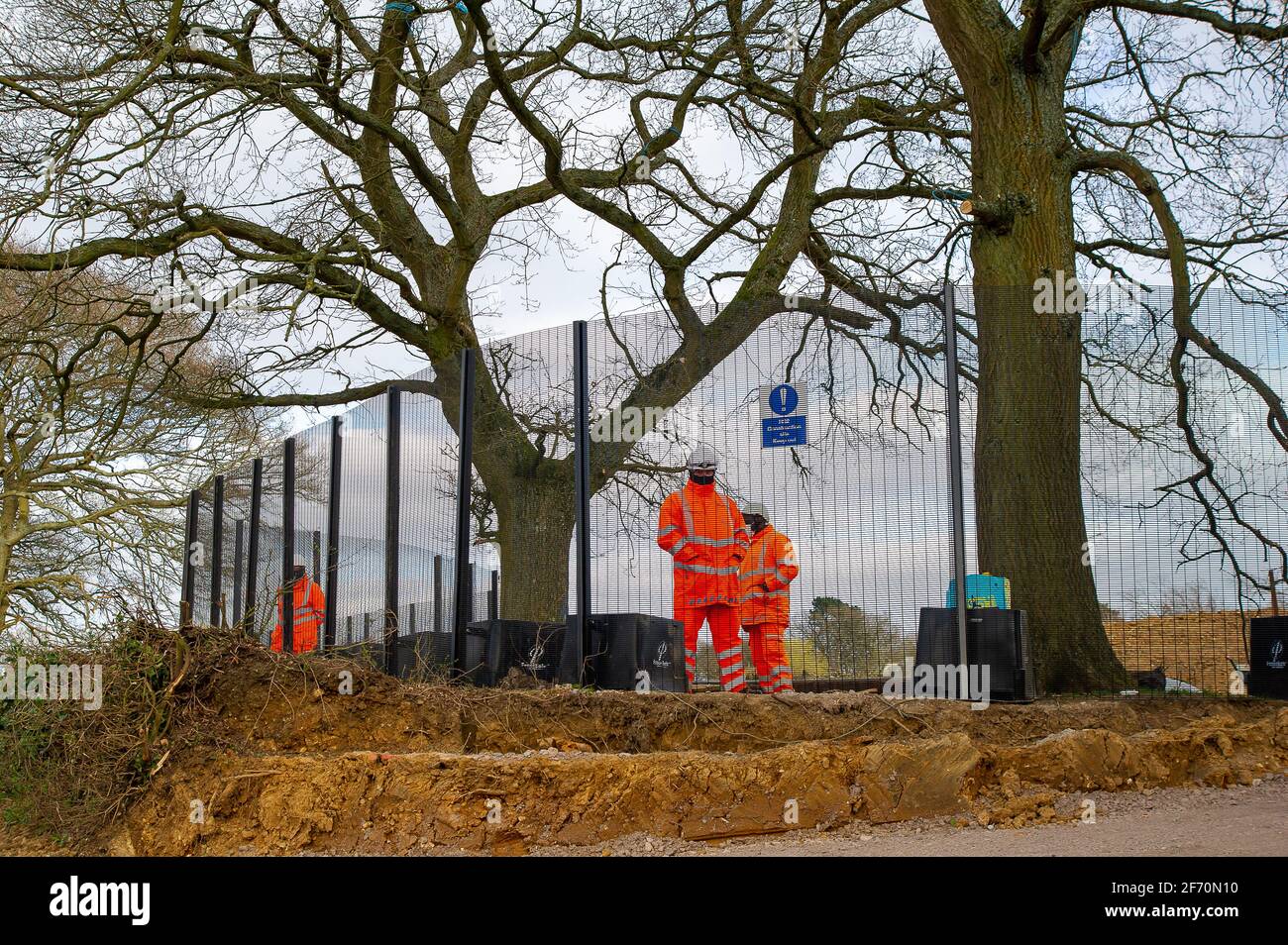 Great Missenden, UK. 3rd April, 2021. HS2 have destroyed a number of iconic and much loved oak trees and ancient hedgerows along the historical sunken Leather Lane with more HS2 felling to follow for a temporary haul road. HS2 Security are in the fields next to the oaks 24/7 and intimidating local residents and members of the public. The High Speed 2 rail link from London to Birmingham is carving a huge ugly scar across the Chilterns which is an AONB. More than 41k people have signed a petition to save the Leather Lane oaks. Credit: Maureen McLean/Alamy Live News Stock Photo