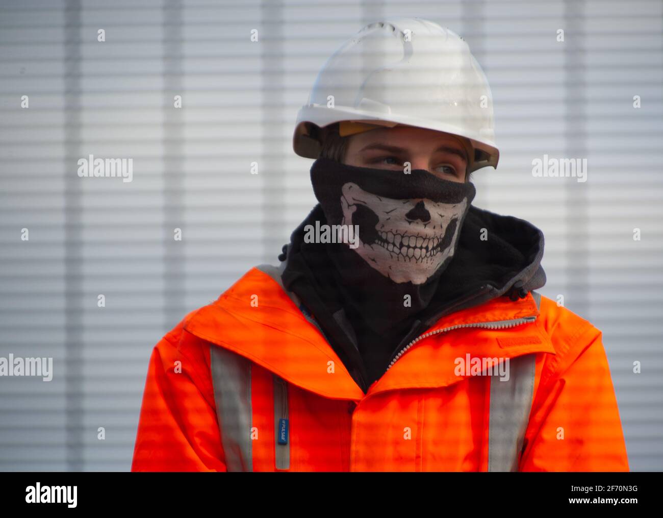 Great Missenden, UK. 3rd April, 2021. An HS2 Security Guard wears a very  inappropriate face mask. HS2 have destroyed a number of iconic and much  loved oak trees and ancient hedgerows along