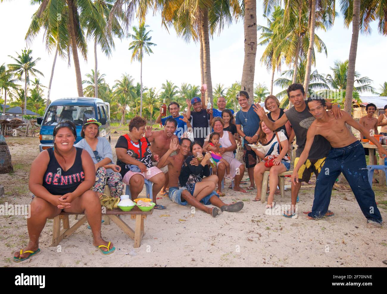 Filipino family and friends enjoying the beach together and a few drinks. Santa Fe, Bantayan Island, Cebu, Philippines Stock Photo