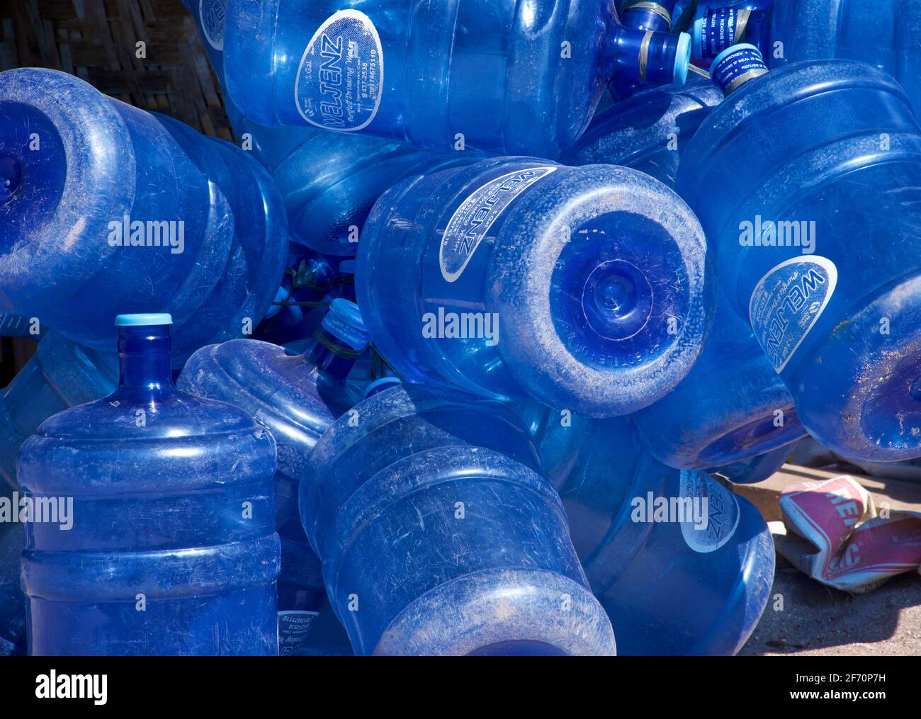 Collection of empty blue plastic water bottles for recycling or resuse, Malapascua Island, Cebu