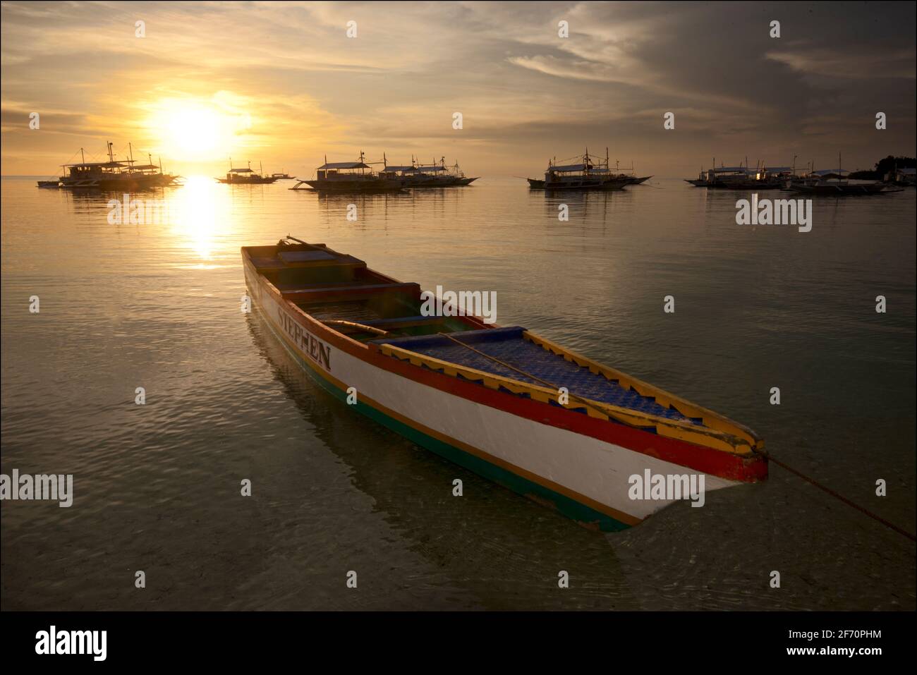 Boat moored off Logon, Malapascua Island at sunset. Visayan Sea, Cebu, Philippines. Stock Photo