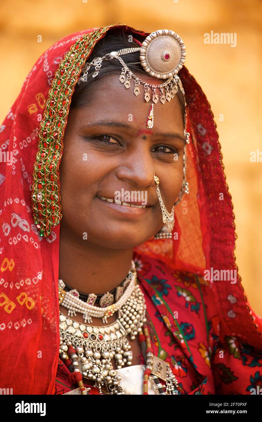 Portrait of a Rajasthani woman in distinctive Rajasthani dress and jewellery, Jaisalmer, India Stock Photo