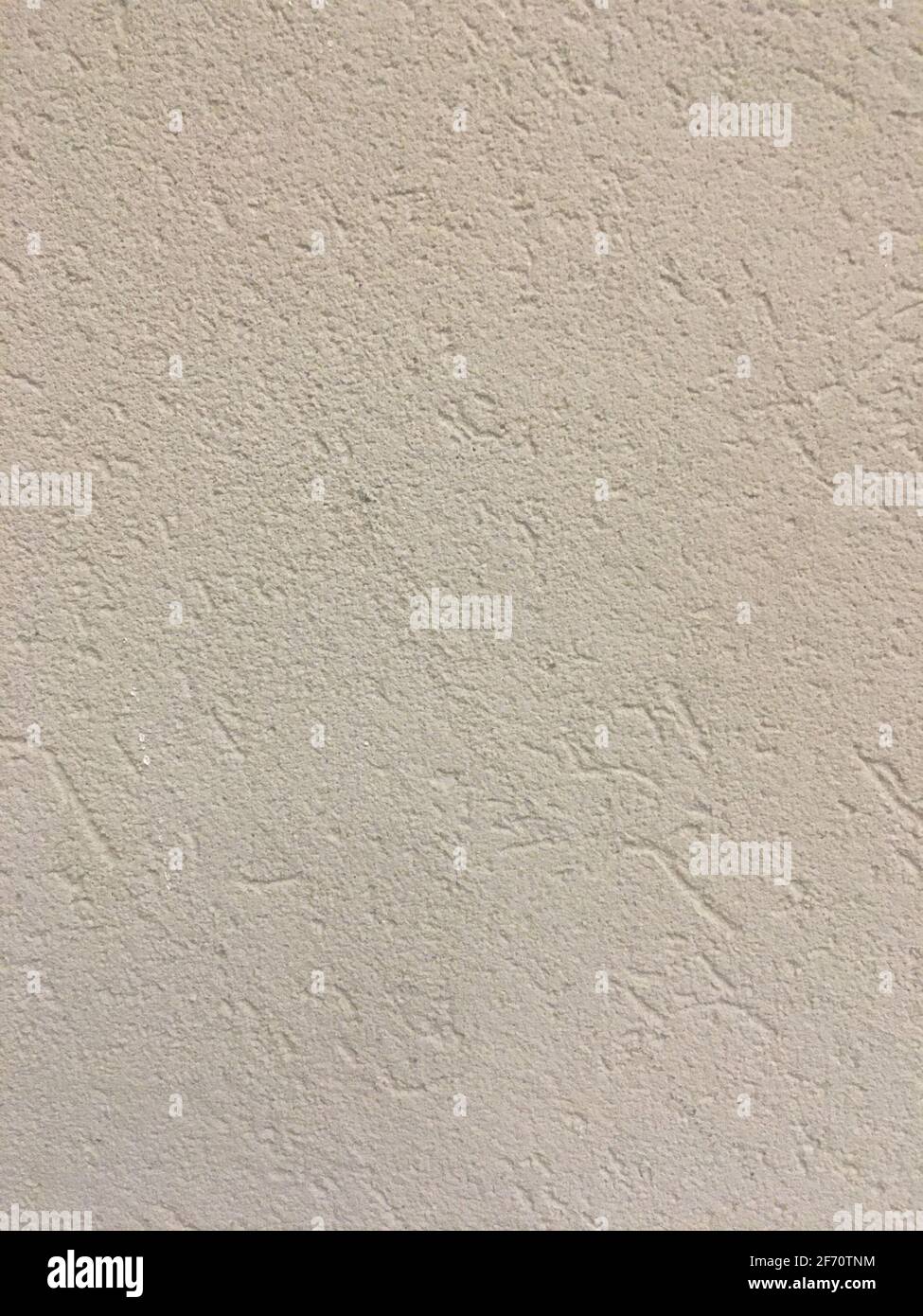 Beige plaster wall texture with rough cement finish Stock Photo