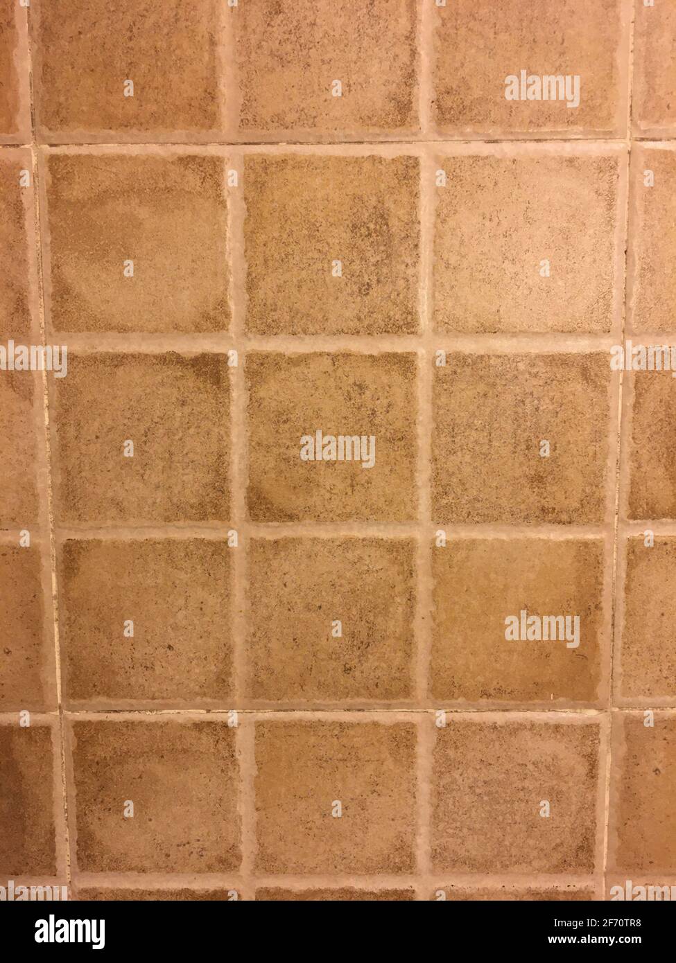 Terracotta square tiles background with rustic grout lines Stock Photo
