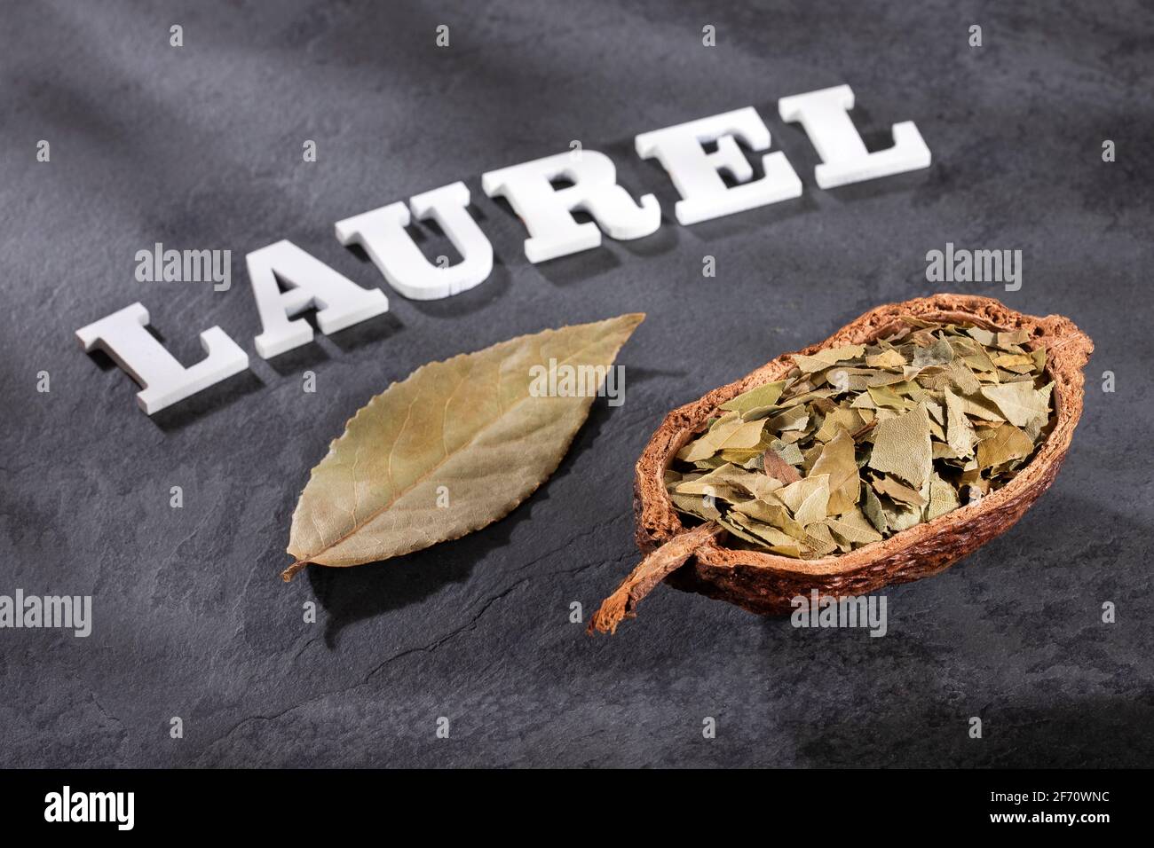 Premium Photo | Dried whole bay leaves on cutting board Laurus nobilis
