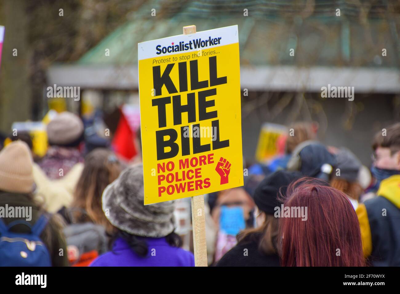 A protester holds a placard that says Kill The Bill during the march in Hyde Park.Thousands of people marched through Central London to protest against the Police, Crime, Sentencing and Courts Bill. Stock Photo