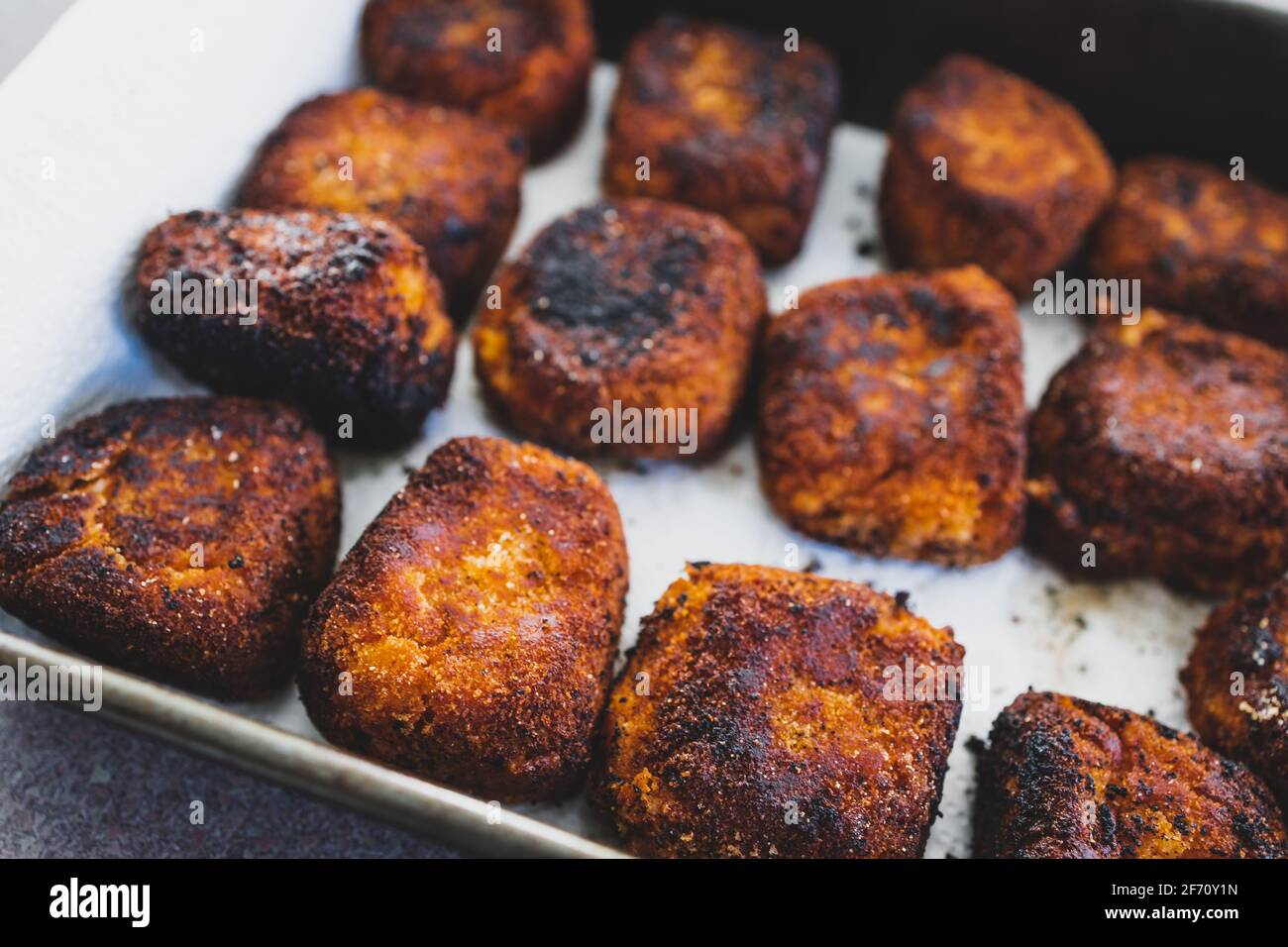 vegan arancini fried risotto balls in tray, healthy plantbased food