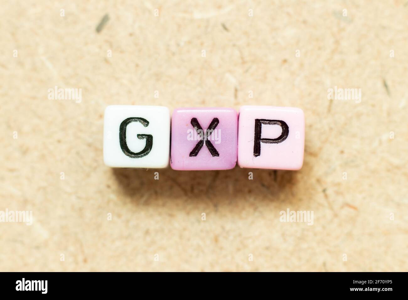 Color alphabet letter block in word GXP on wood background Stock Photo ...