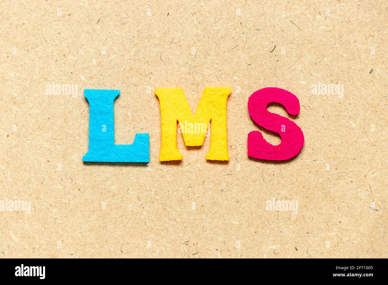 Color cloth alphabet letter in word LMS (Abbreviation of Learning  management system) on wood background Stock Photo - Alamy
