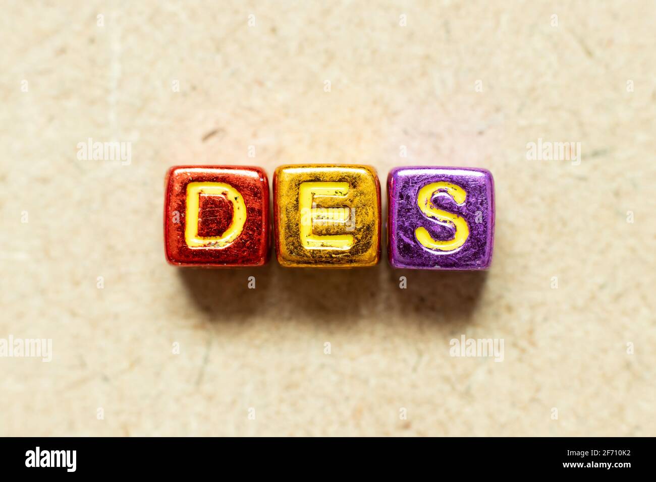 Metallic color alphabet letter block in word DES (Abbreviation of ...